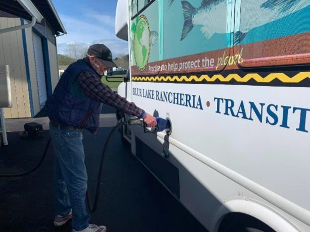 Driver fueling a BLRTS bus