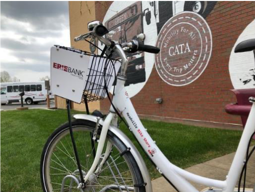 Picture of a CATA bikeshare bike in front of CATA's headquarter building